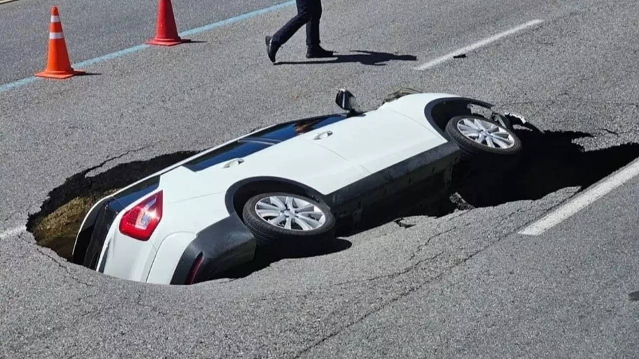 sinkhole swallows suv in seoul: dramatic footage shows elderly couple's ordeal