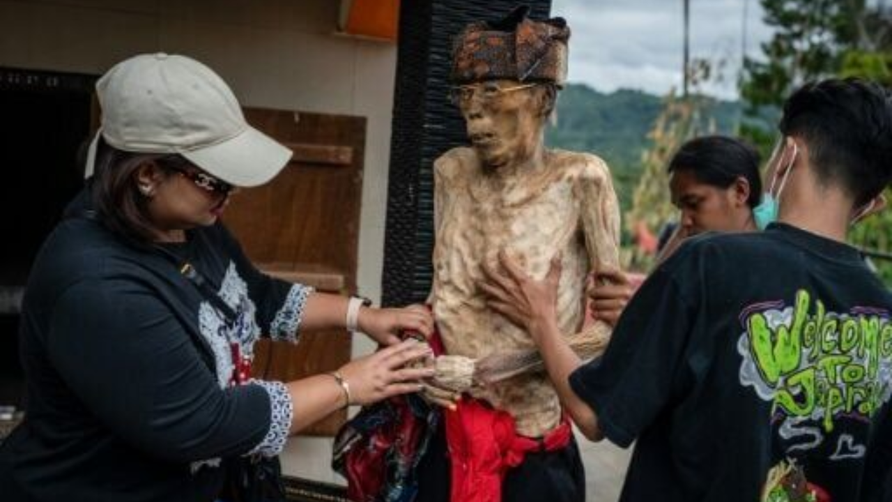 indonesian villagers dress & preserve, corpses: ritual for dead will shock you