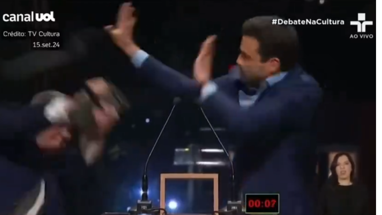 on live tv, brazil mayoral candidate attacks his rival with metal chair during debate