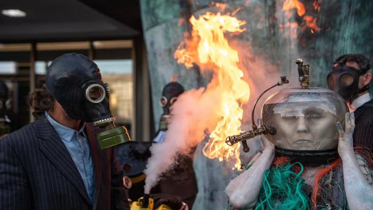 'ocean goddess' pretends to drown in oil outside un agency in london to protest against imo