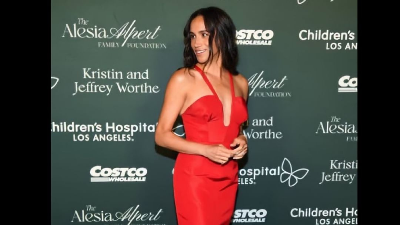 meghan markle reworks red halter-neck gown for surprise appearance at children’s hospital gala