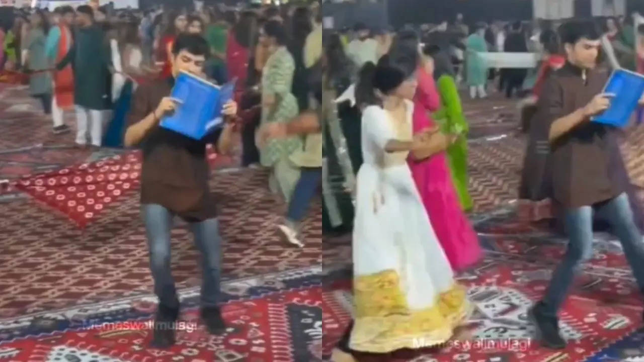 'when your relatives are there at same event': man performs garaba while reading book; internet reacts