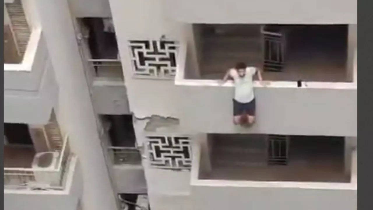 man tries to jump from apartment balcony in noida, what happens next - video