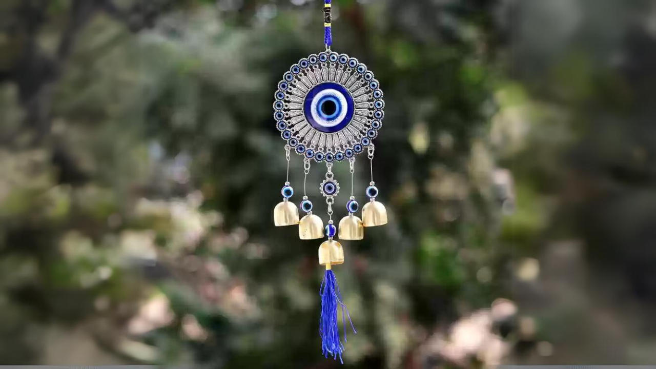 tips to decorate your home with evil eye wind chimes according to vastu