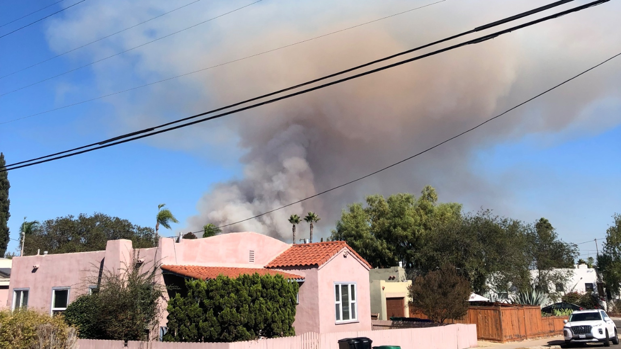 san diego fire: bush fire creates large smoke near spring valley, college area in california