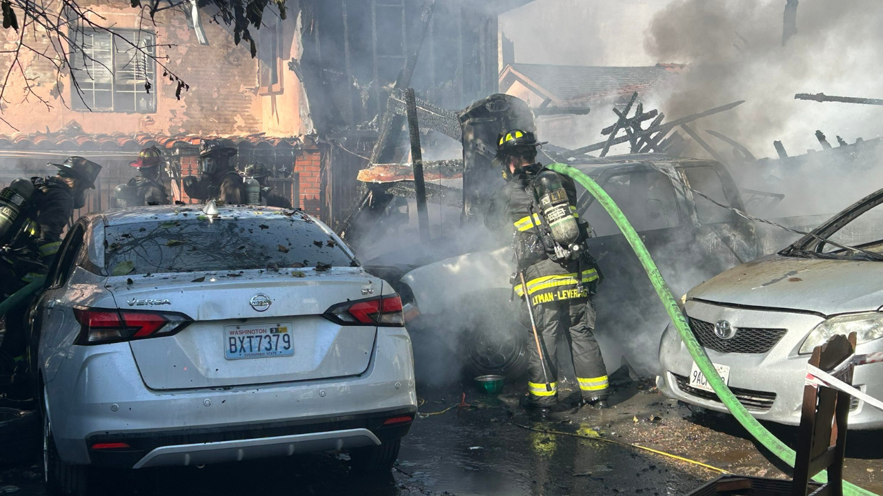 oakland fire: large smoke near bay area residential area in california, fire crew at work